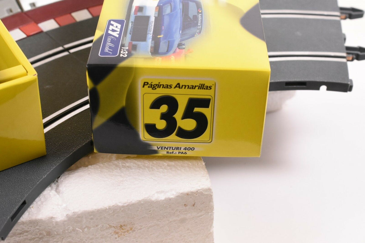 Yellow track section box for 35th race, featuring a blue race car model for FLY CAR PA 6