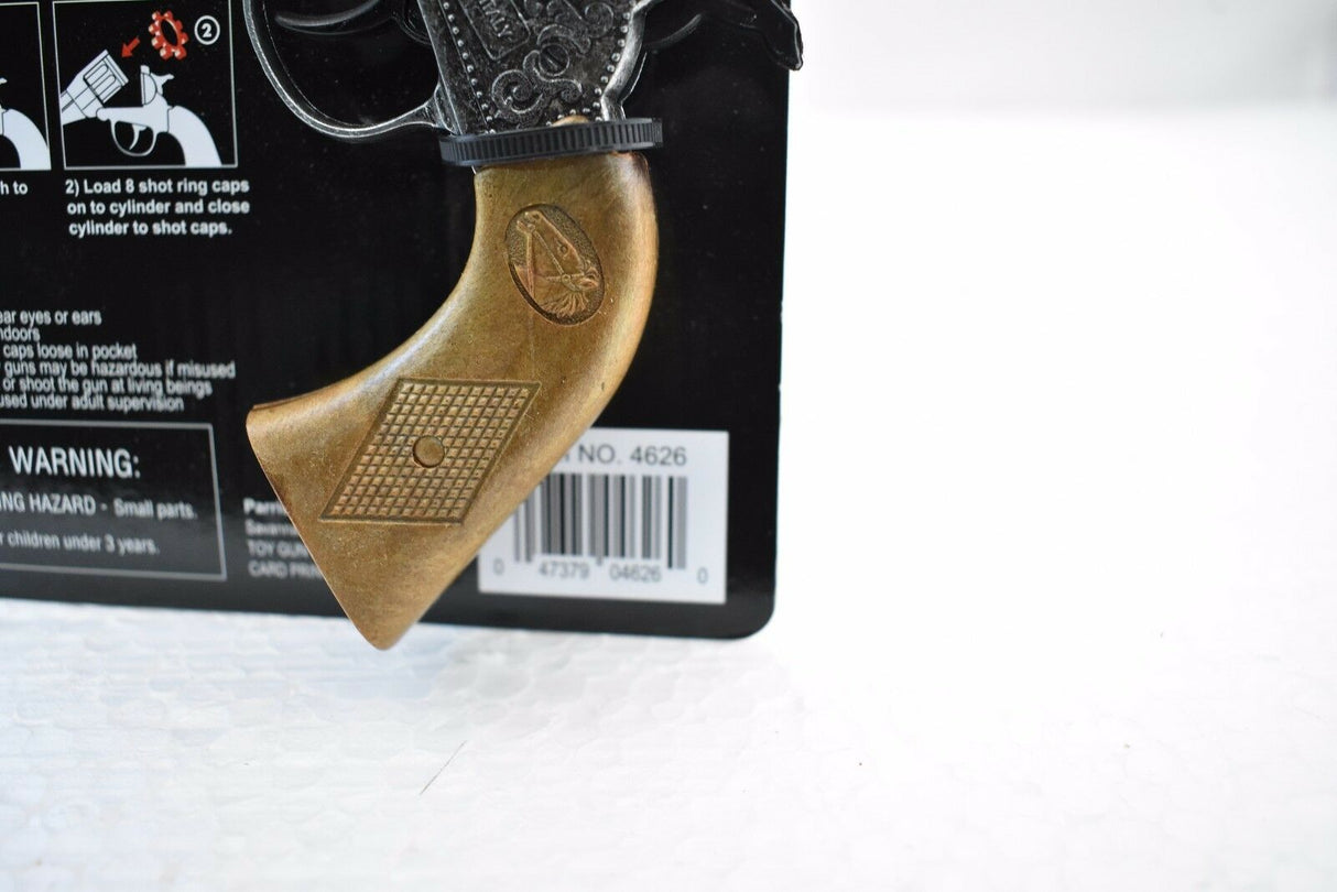 Revolver grip detail showing loading instructions for shot caps for Parris Toys 4626