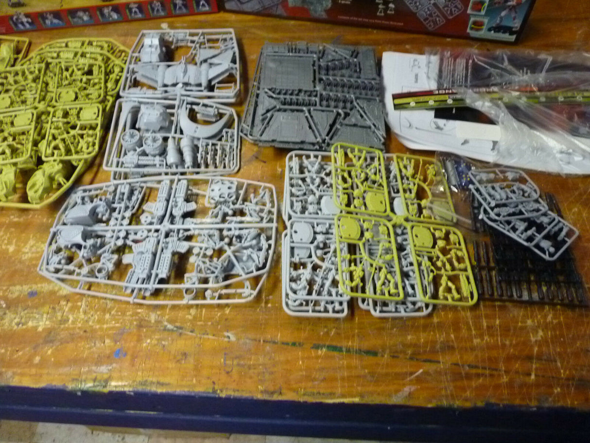 Assortment of gray and yellow plastic model kits for tabletop wargaming for IMEX 6000