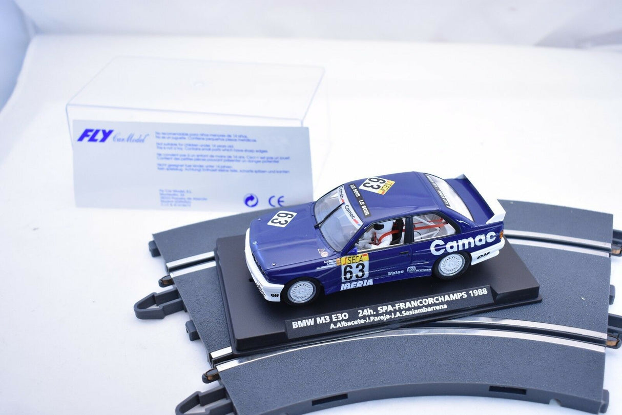 Slot car of a 1988 BMW M3 E30 race car on a display base for FLY CAR 96092
