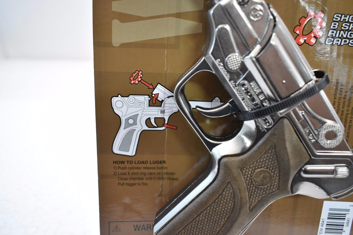 Metal toy gun with loading instructions visible on the packaging for Parris Replica 4641C