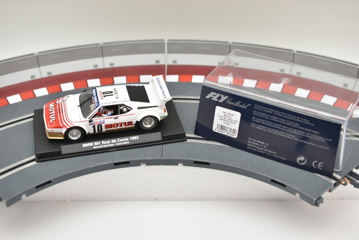 Scale model of a 1982 BMW M1 race car on a track section for Fly Car 88180