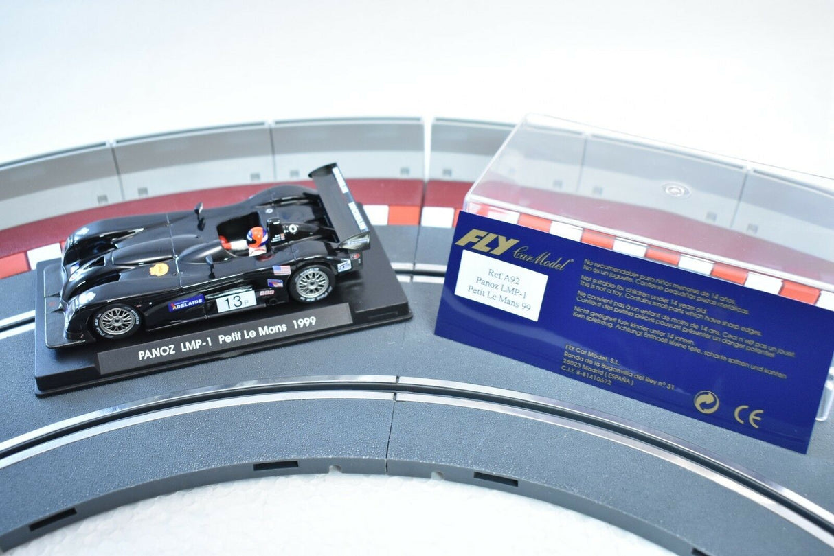 Black race car model, Panoz LMP-1 Petit Le Mans 1999, on display stand for Fly Car A92