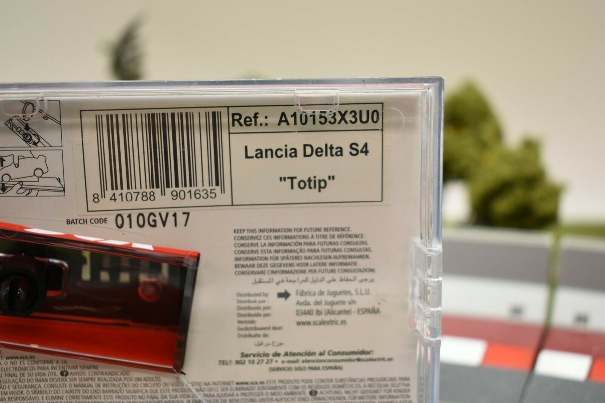 Product box showing "Lancia Delta S4 'Totip'" model number and batch code for SCX A10153X3U0