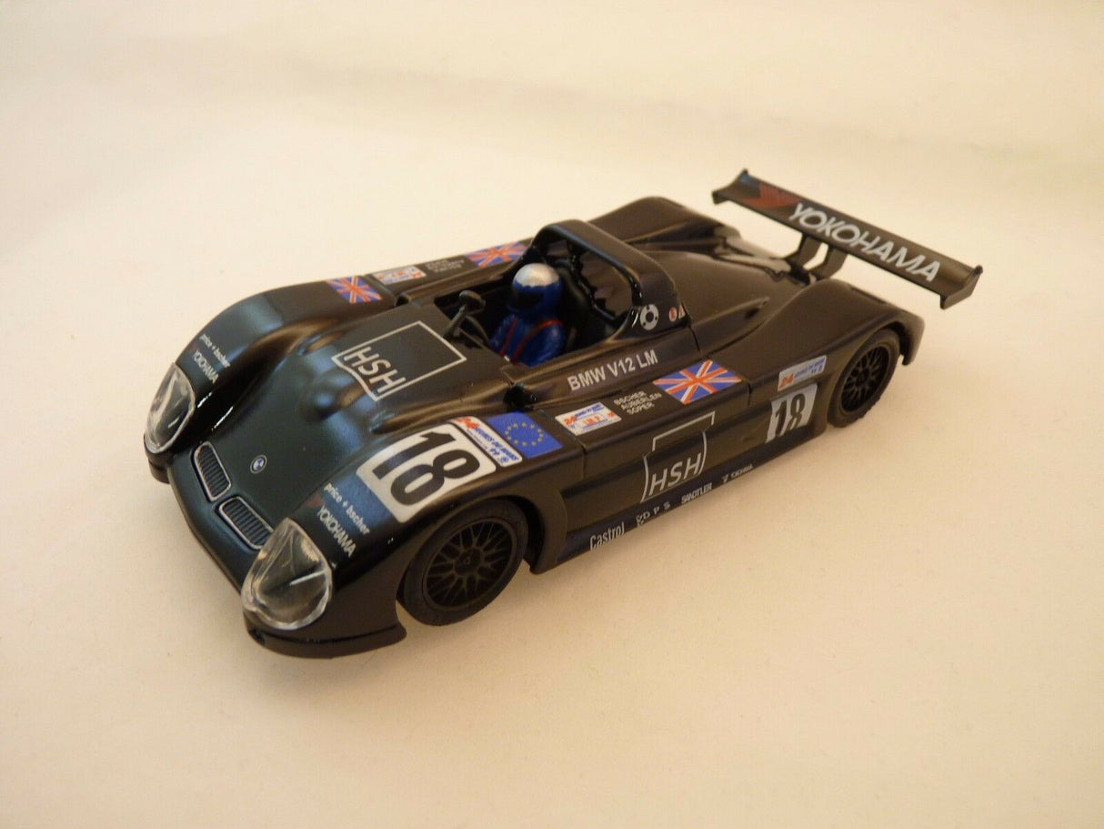 Black slot car, BMW V12, with "HSH" and "YOKOHAMA" decals for Ninco 50213
