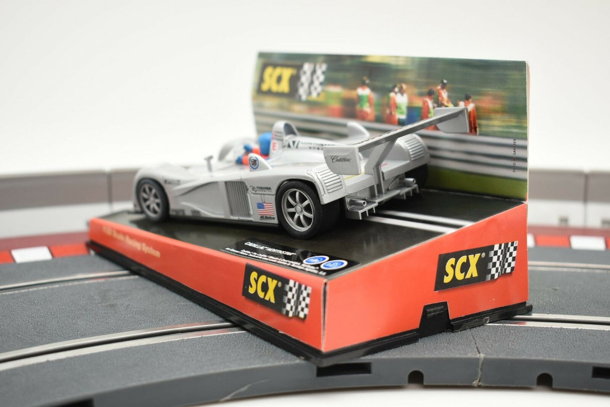 Scale model of a Cadillac Northstar race car on a track display for SCX 60470