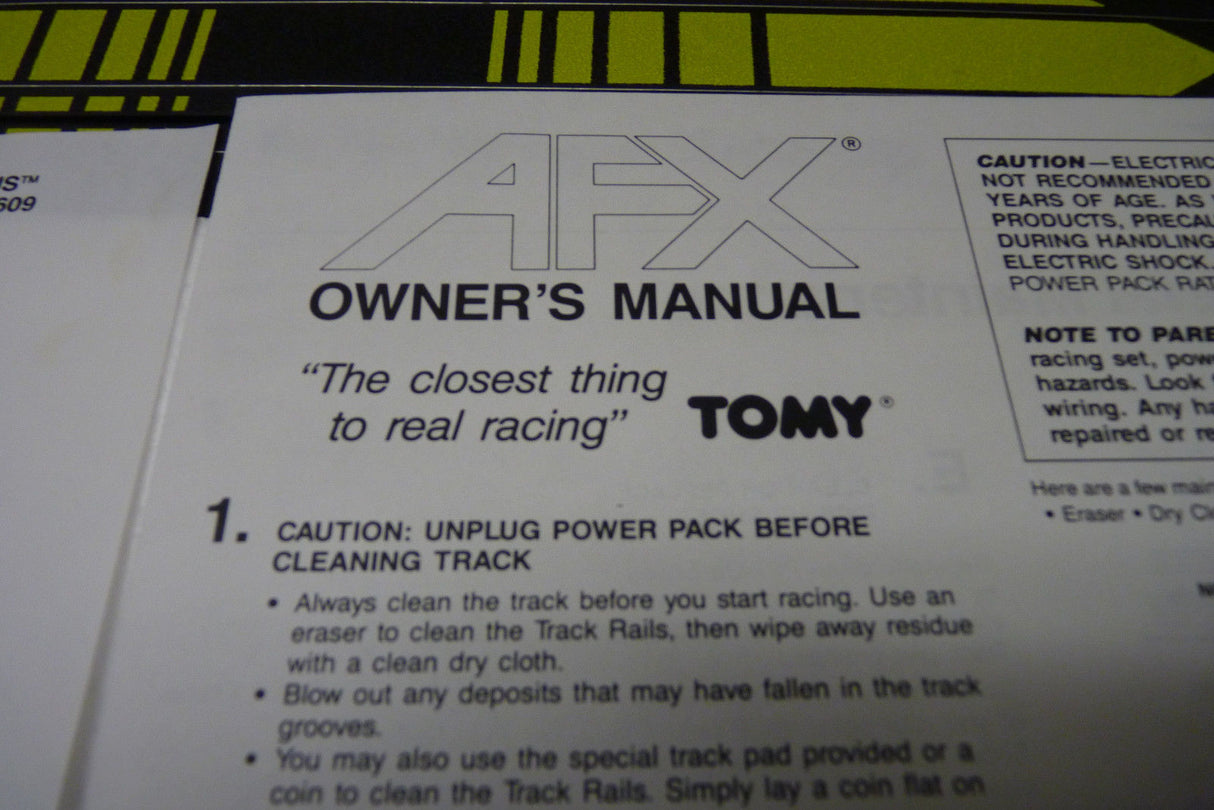 Owner's manual for AFX race set, detailing cleaning instructions for Aurora Tomy AFX Vintage 8607M