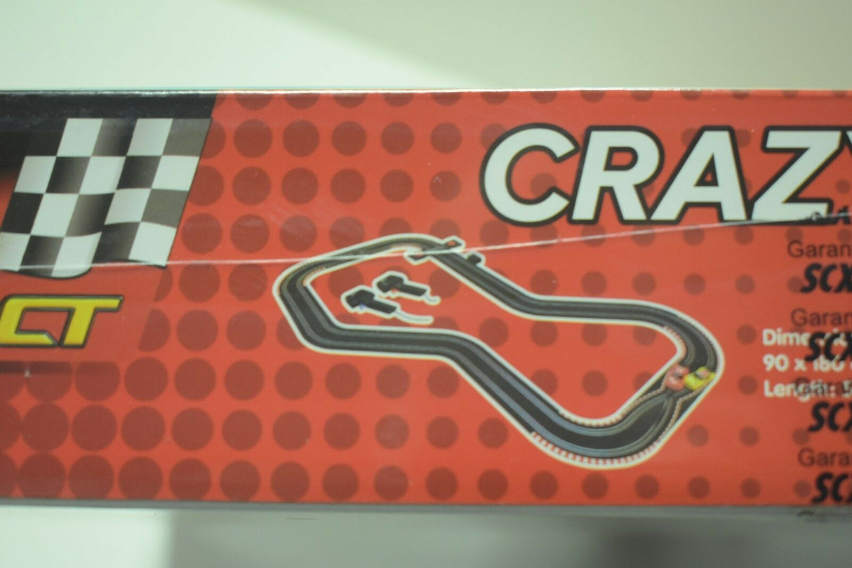 Race track layout graphic on a red and black box for SCX Compact C10125X5U0