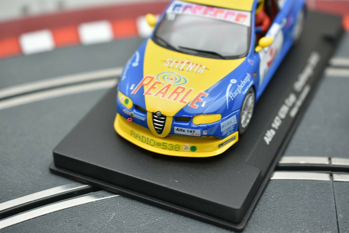 Blue and yellow race car model on a black display base for Fly Car 88143