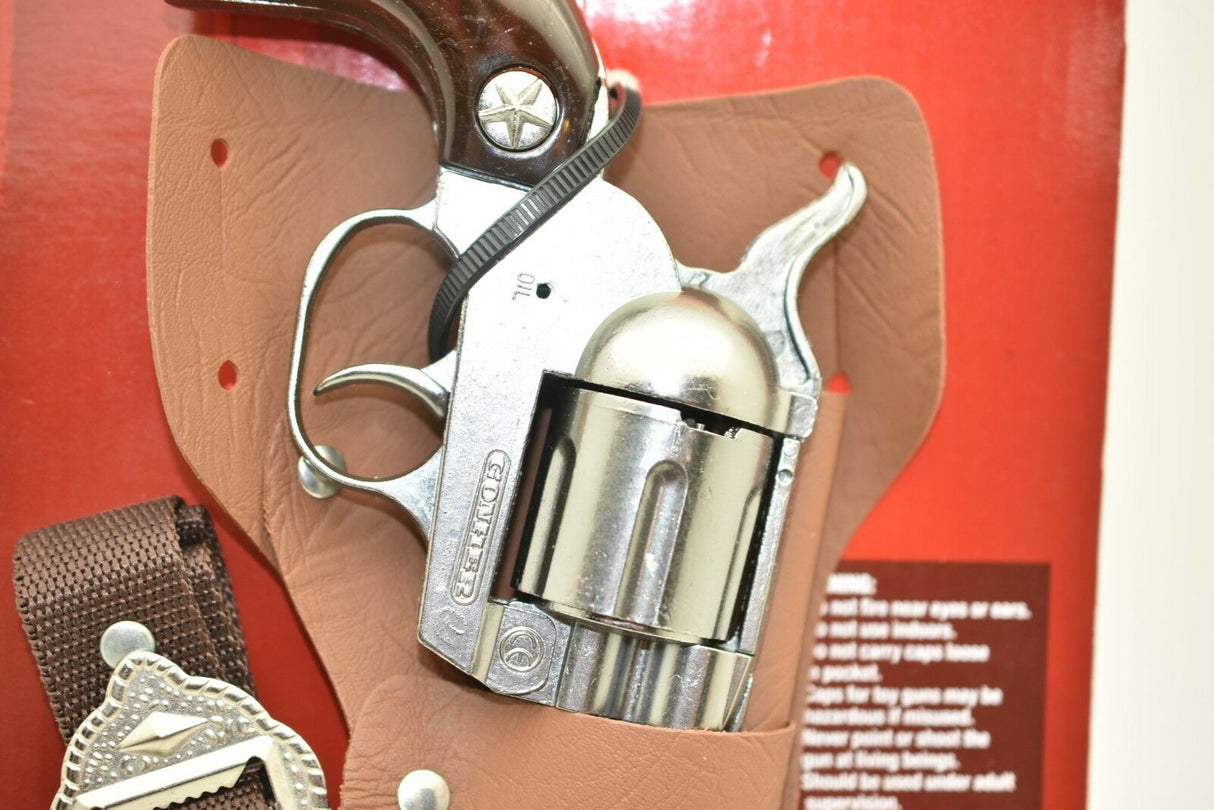 Toy pistol holstered on brown leather, ready for display for Parris Toys 4707C