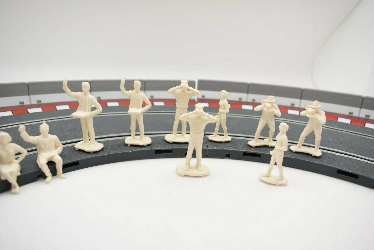 Unpainted 1/32 scale figures of motor racing spectators lined up for HORNBY 303058821440, rear view