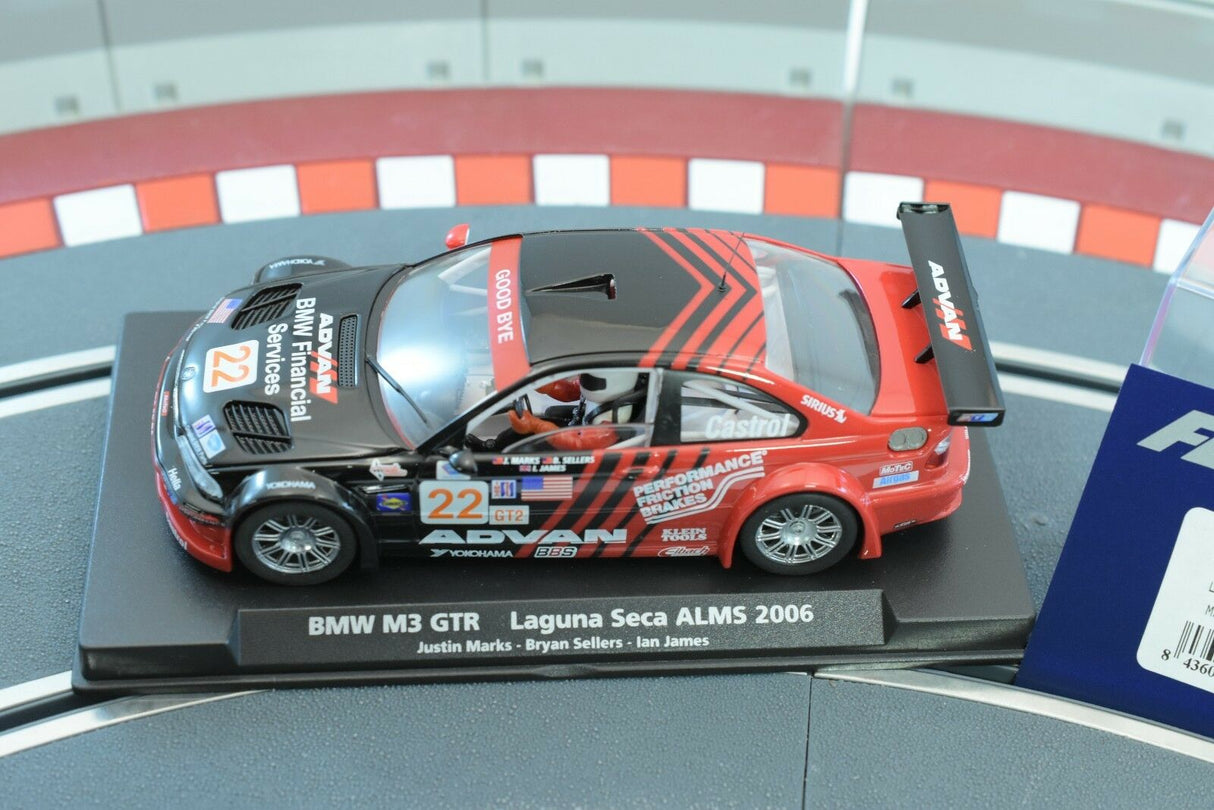 Slot car of a 2006 BMW M3 GTR race car on a display base for Fly Car 88266
