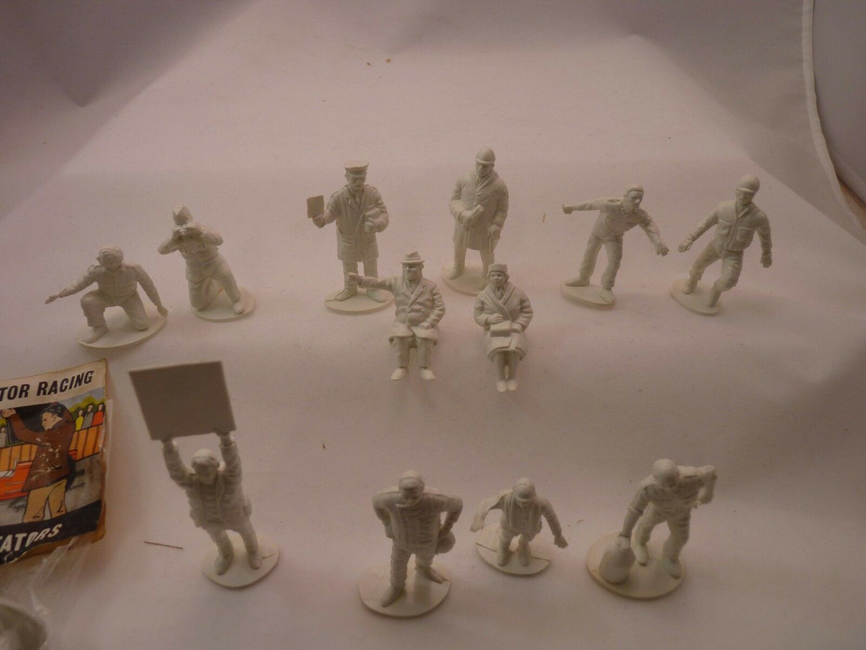 Unpainted plastic figures of motor racing racers and spectators for AIRFIX