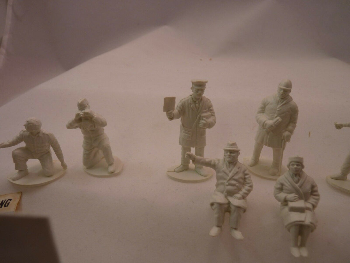 Unpainted miniature figures of motor racing track officials and spectators for AIRFIX, track view