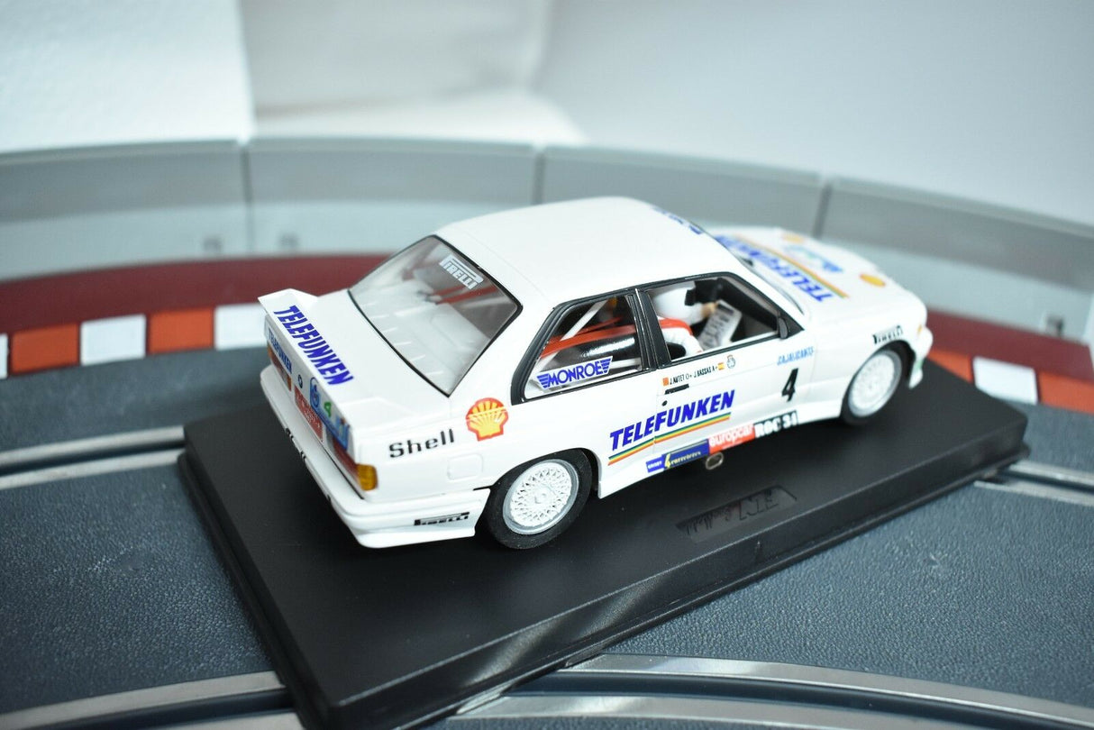 White BMW M3 E30 rally car model on a black display base for Fly Car 88203