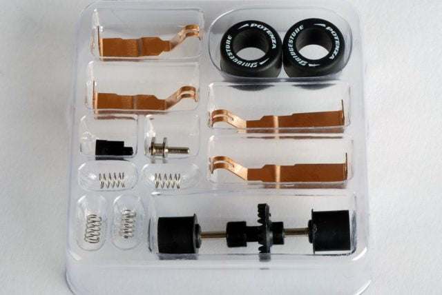 Bike tune-up kit components: bearings, springs, and wheel parts in a clear case for AFX/Racemasters 70330