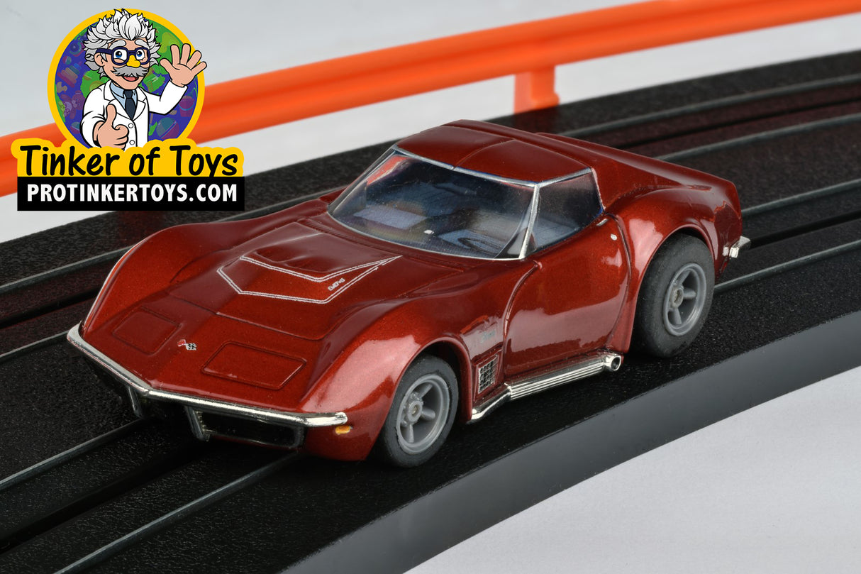 Red metallic 1970 Corvette LT1 slot car on a track for AFX/Racemasters 22038, track view