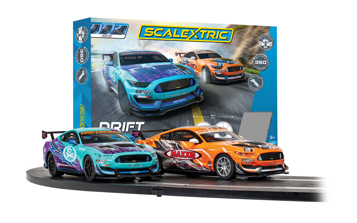 Three colorful slot cars ready for a drift race on a track for 1/32 slot cars Scalextric C1421