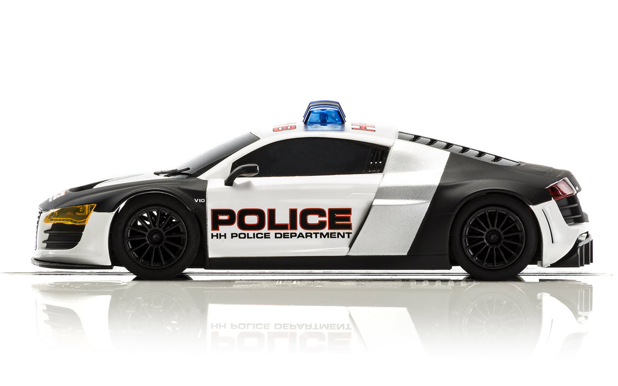 Black and white police car model with flashing blue lights for Scalextric C3932