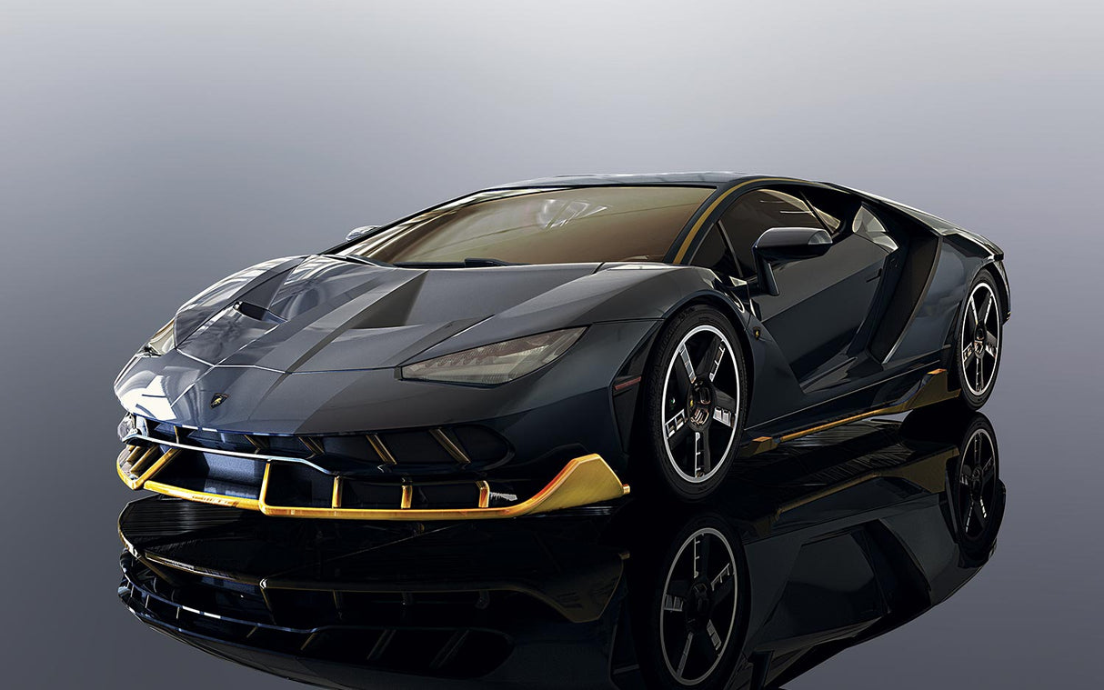 Dark Lamborghini Centenario model car with gold accents on a reflective surface for Scalextric C3961