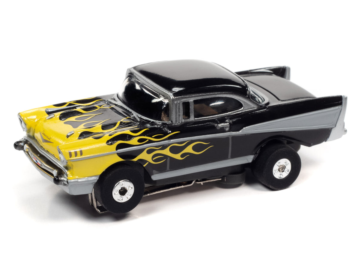 Black and yellow 1957 Chevy Bel Air slot car with flame decals for Auto World CP7818