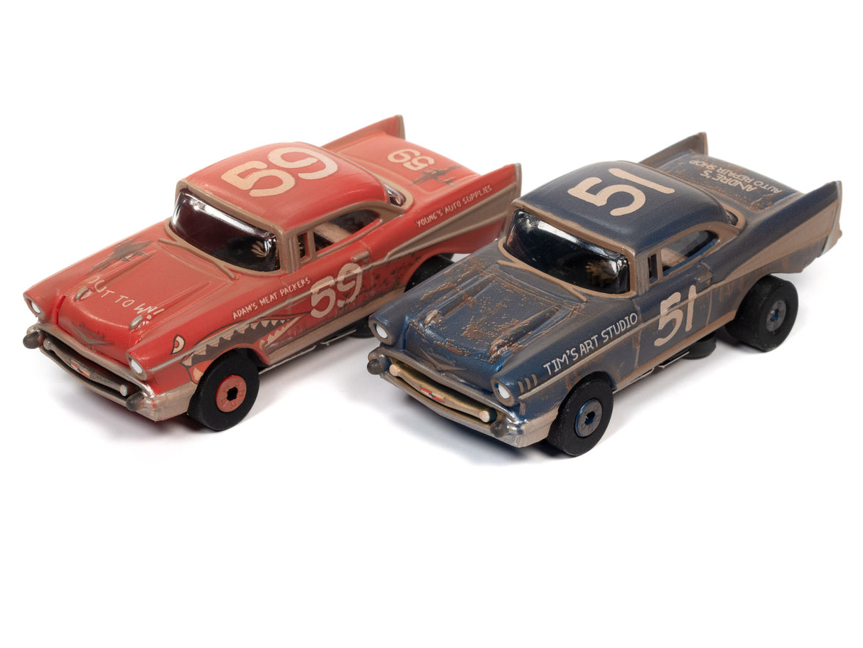 Two vintage slot cars: a red 1957 Chevy and a blue sedan for Auto World CP7822