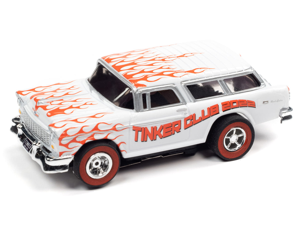 White 1955 Chevy Nomad toy car with orange flame graphics for Auto World
