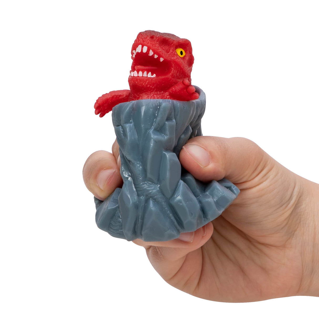 Red dinosaur figure on a gray volcano base, held in a hand for Schylling DPOP