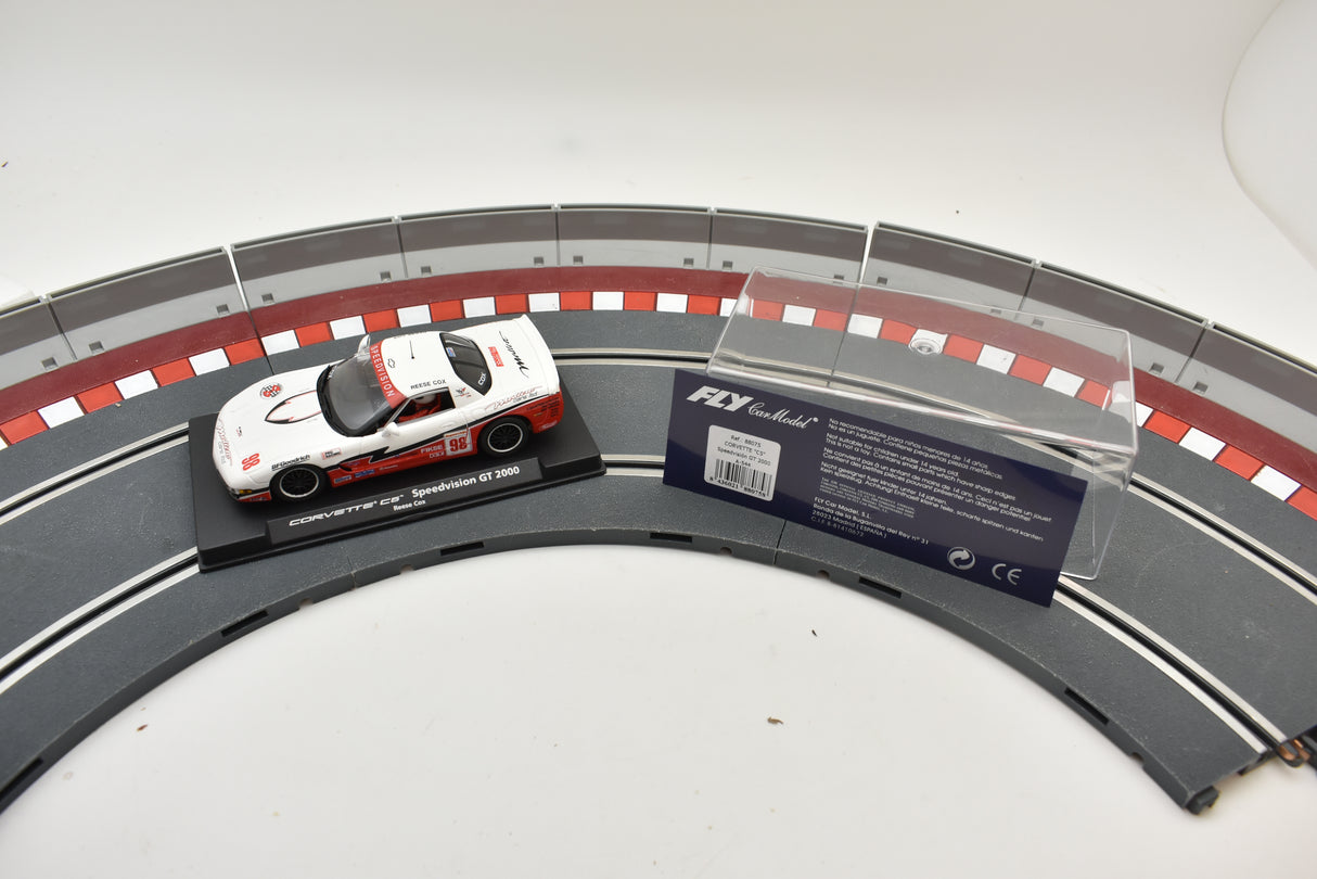 Red and white Corvette race car on a track section with product details for Fly Car 88075