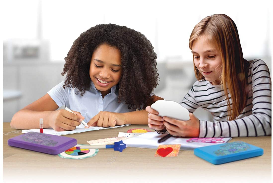 Two girls work together with a secret message lab kit on a table for Smart Lab 00453