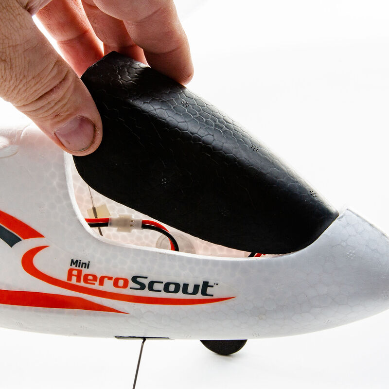 Hand holding the nose cone of a small model aircraft for HobbyZone HBZ5700