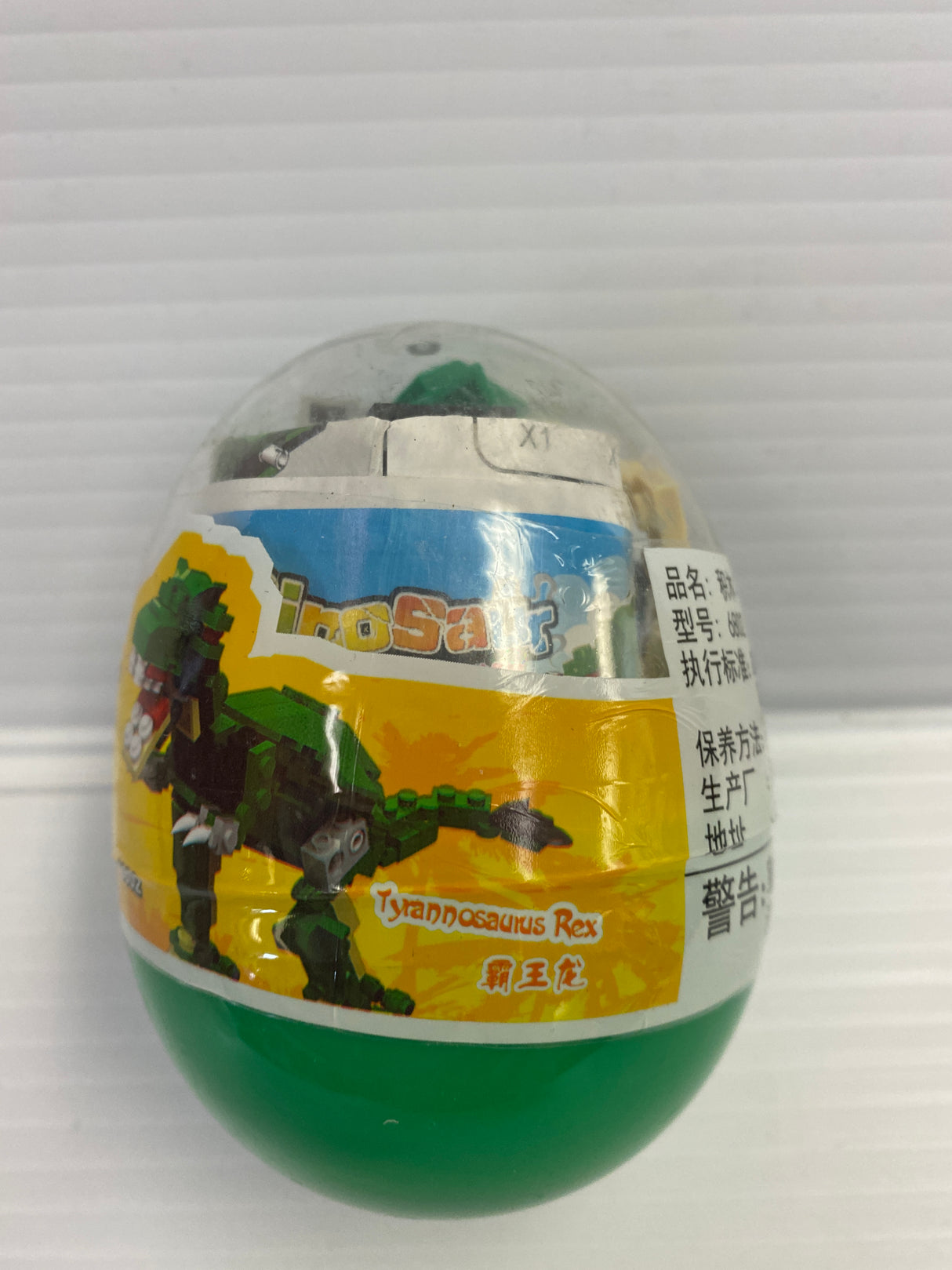 Dinosaur egg block with T-Rex graphic and product details for IMEX Model Company WAG68016