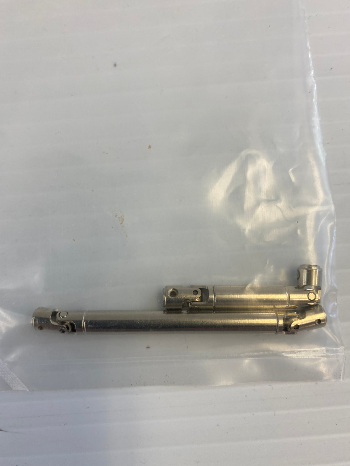 Metal crawler part assembly, showing two connected metal pieces for Imex R.C IMX(25510-25911)