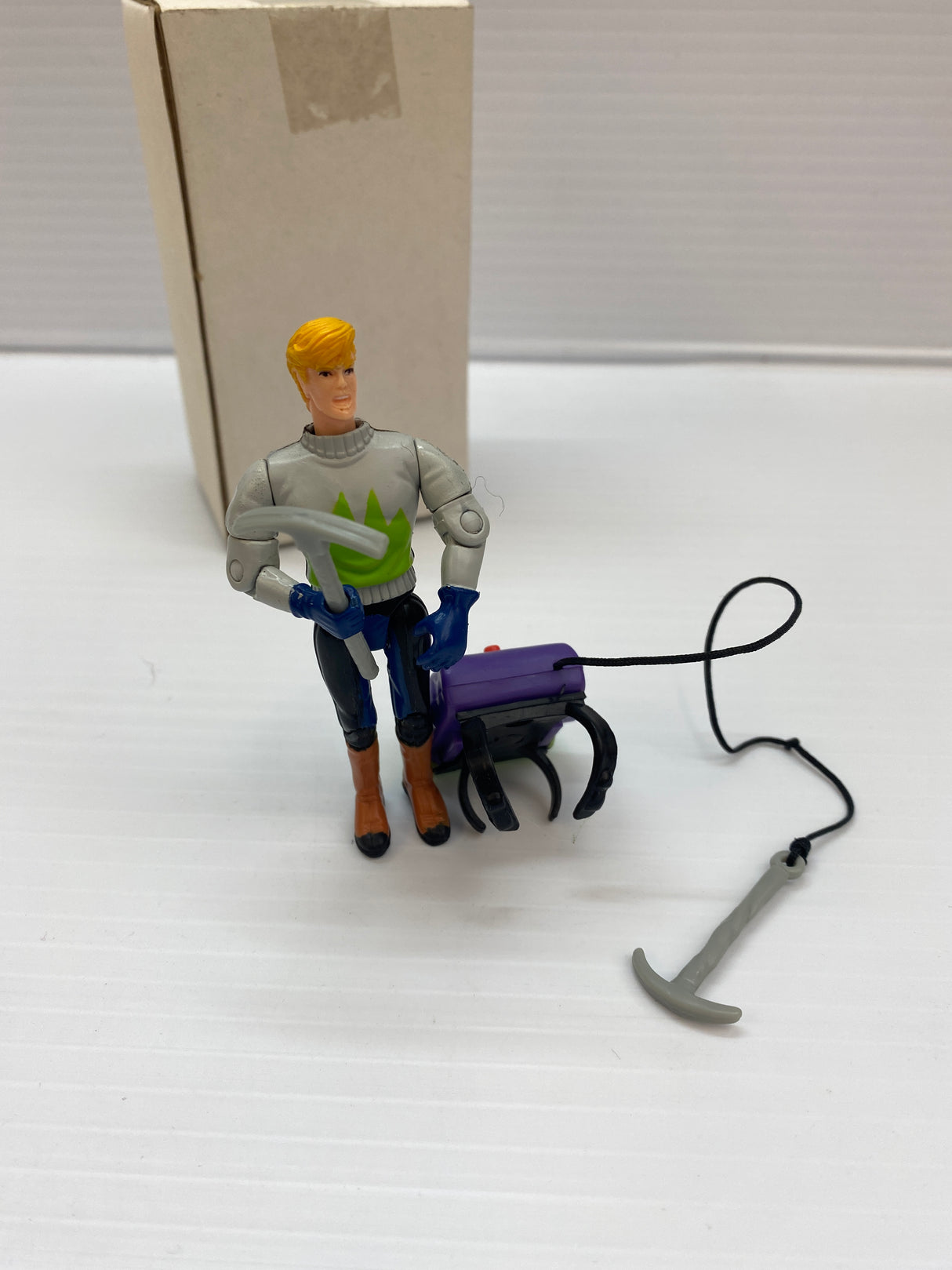Action figure of Jonny Quest with backpack and attached grappling hook for Galoob 74843, rear view