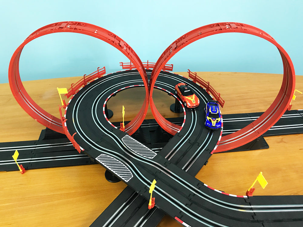 Red loop track with race cars on a wooden surface for EXCLUSIVE JLRS001