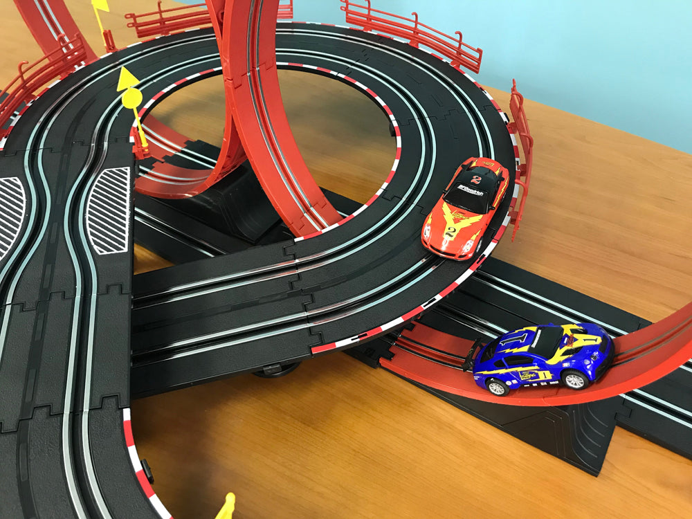 Race track with three remote control cars on the loop for EXCLUSIVE JLRS001