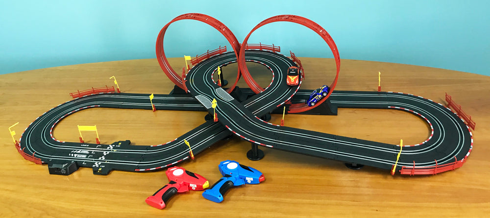 Remote control race track with loops and two small race cars on a wooden surface for EXCLUSIVE JLRS001
