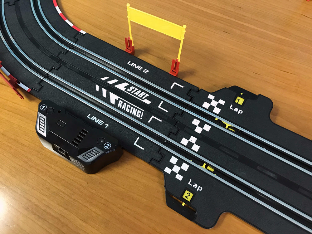 Black and yellow slot race track with two lanes and remote controllers for EXCLUSIVE JLRS001