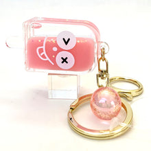 Pink popsicle face key charm with a round, sparkly acrylic pendant for BC Mini 12063, rear view