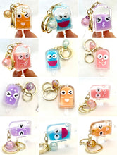 Assortment of colorful, character-themed key charms for BC Mini 12063