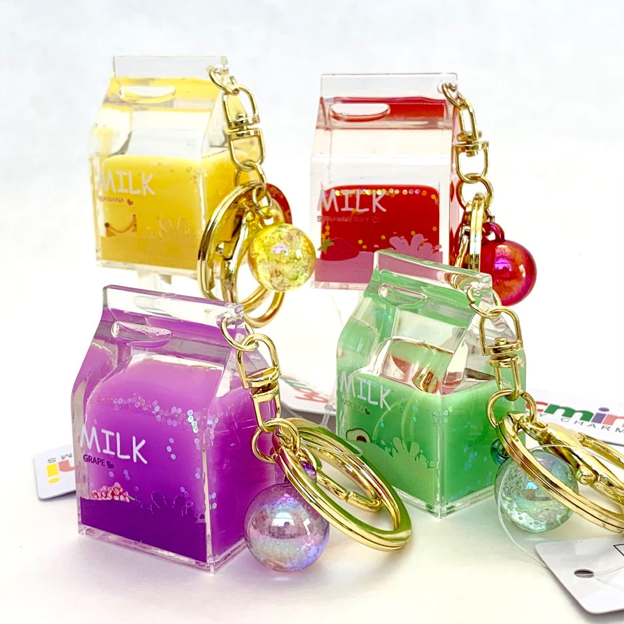 Assortment of colorful, mini milk-themed key charms with fruit designs for BC Mini 12058