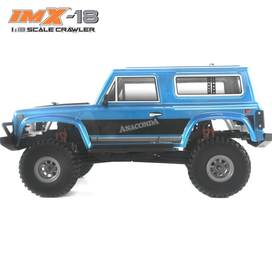 Blue 1:18 scale crawler vehicle with large off-road tires for IMX IMX25005, rear view