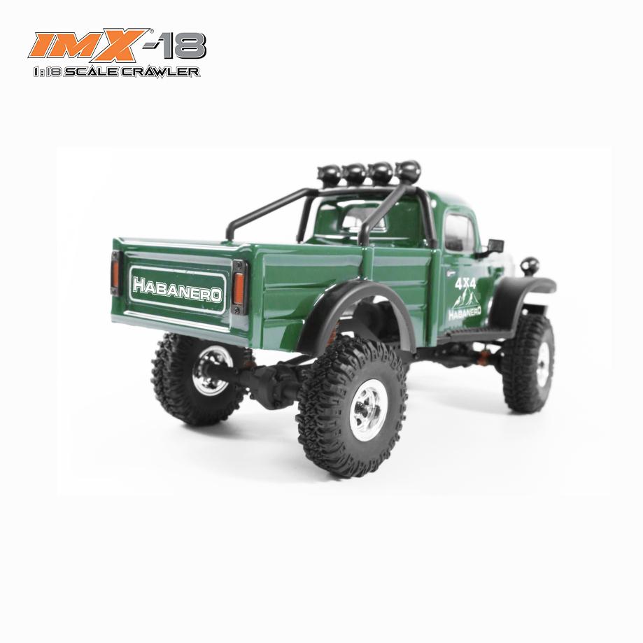 Green 1:8 scale crawler vehicle with off-road tires and accessories for IMX IMX25010