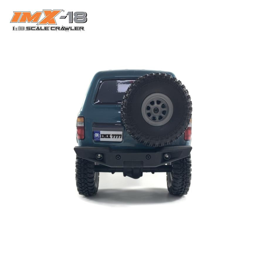 Rear view of a scale crawler vehicle with large off-road tires for IMX IMX25020
