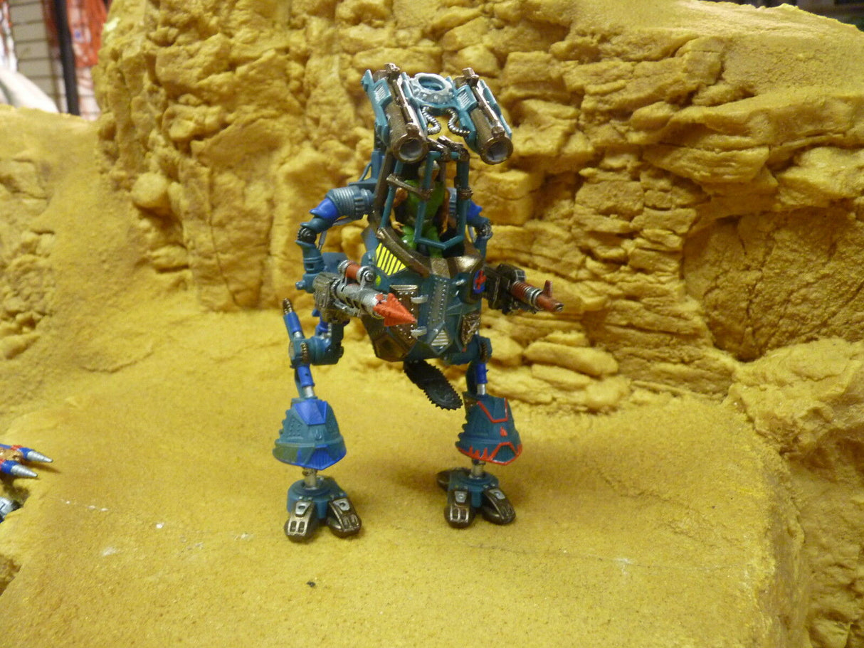 Blue and green robot action figure standing on yellow textured surface for Robogear 6007