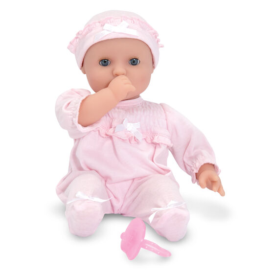 Doll in pink outfit with pacifier, lying down for Melissa and Doug 4881