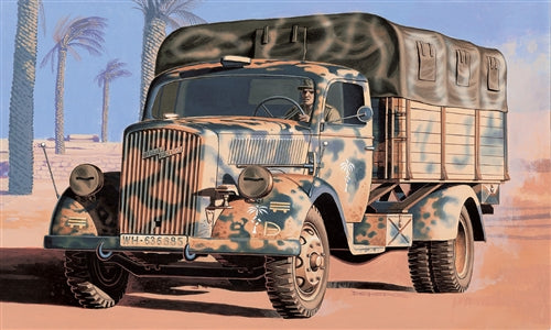Military truck model, Opel Blitz, painted in camouflage colors, parked in a desert setting for Italeri
