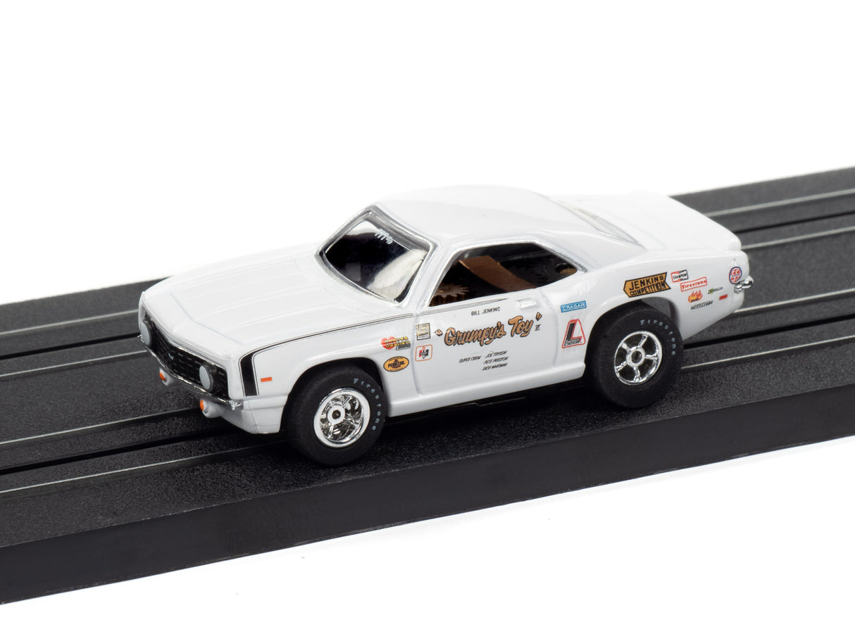 White 1969 Camaro slot car with "Grumpy's Toy" decals on a track for Auto World 1969 Chevrolet Camaro