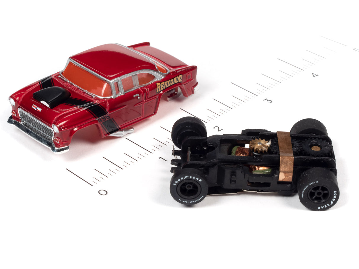 Red muscle car toy and disassembled black car toy on a ruler for Auto World SC354