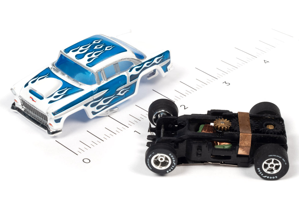 Blue and black slot car muscle car toys on a ruler for scale for Auto World SC354